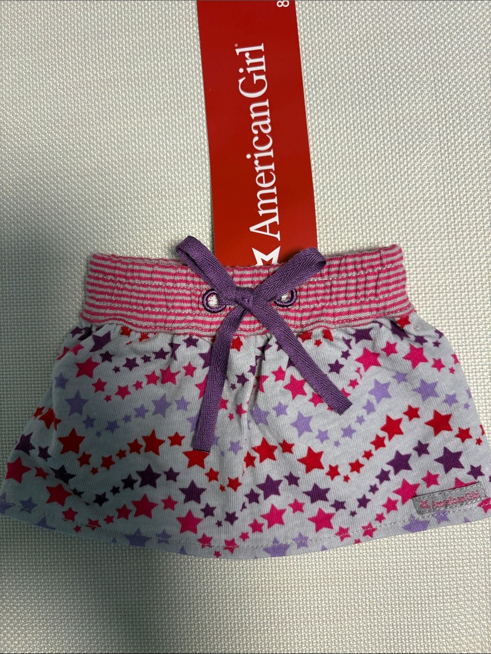 American Girl Pink Striped Waist Skirt with Purple Bow and Multi-Star Print